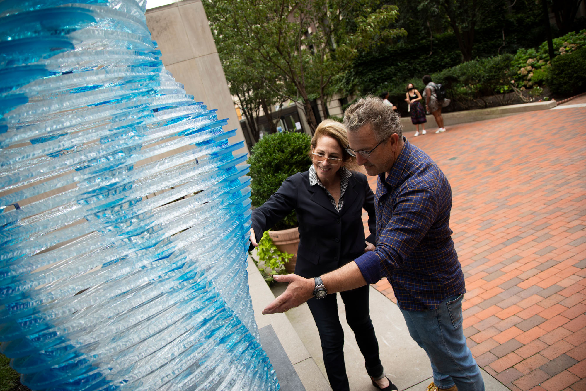 Joan Snitzer and Henry Richardson discussing the sculpture
